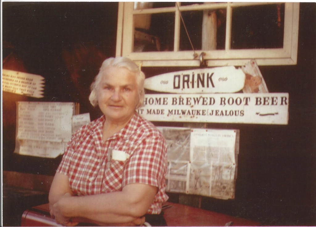 Dorothy standing in front of a brewing station in her museum.